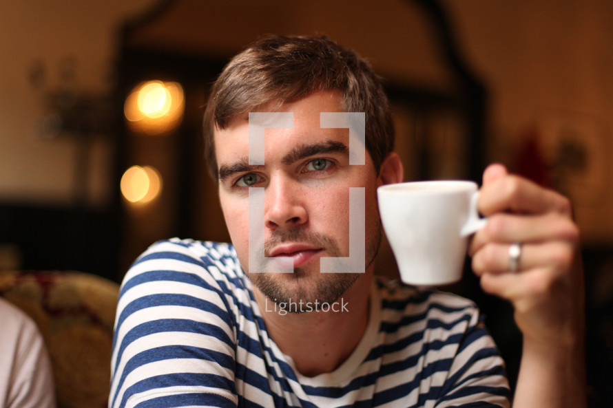 man sipping expresso 