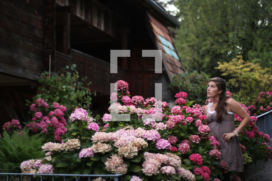 woman standing in a flower garden 