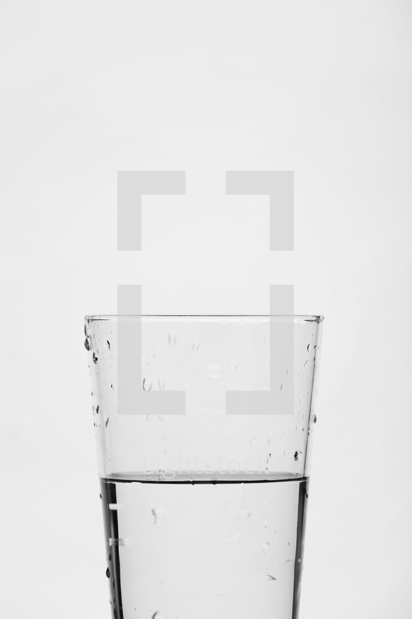 glass half full of water.
