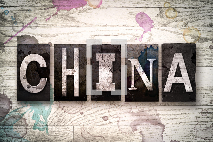 word China on white washed wood