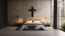 Christian home interior. Modern bedroom with concrete walls, concrete floor, and wooden cross over the bed.