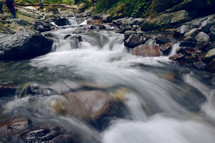 the rapid flow of the river