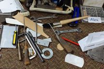 tools spread out on a floor 