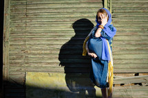 a young girl playing Mary hiding her face 