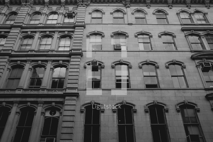 windows on a city building 