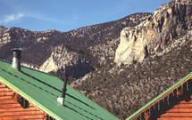 cabin roof and mountain peaks