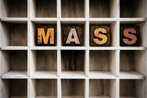 word mass on a wood shelf 