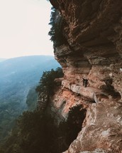 fog in a valley near a mountainside cliff 