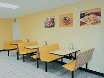 empty booth seats in a donut shop 