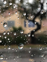 rain droplets on window glass during a rain storm 