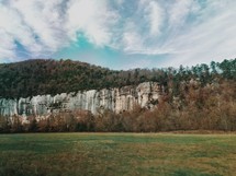 stone mountain cliffs and meadow 