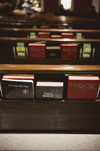 Pews full of Bibles and hymnals