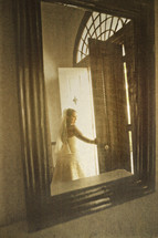 A bride reflected in a mirror