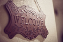 welcome sign on wall