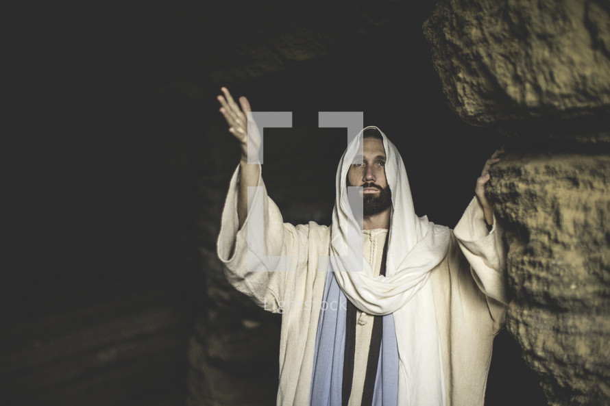 Jesus standing at the entrance of a tomb 