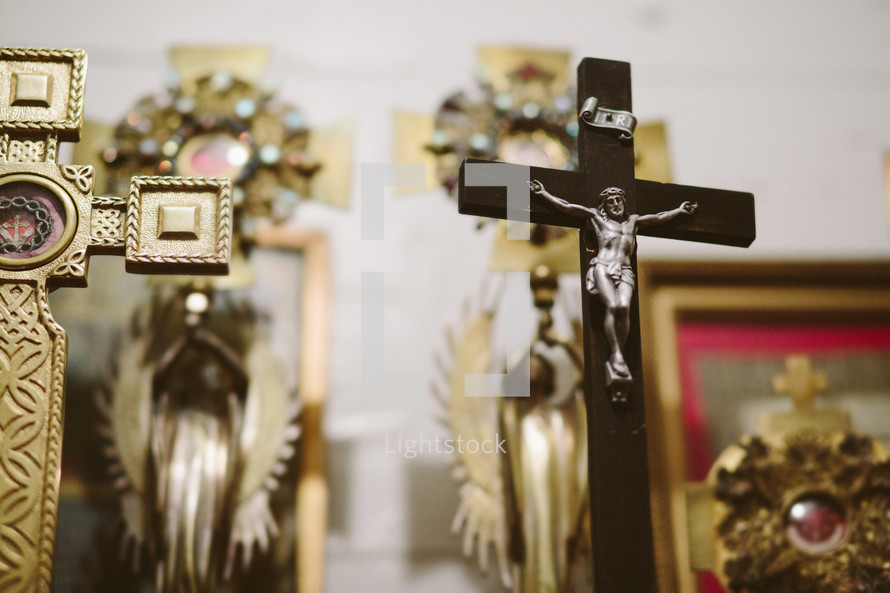 Crucifix with saint relics in a Catholic church.