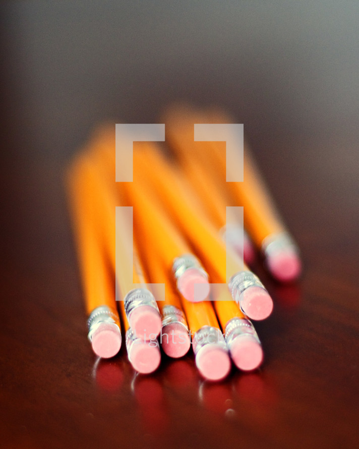Pencils on a wooden desk.