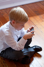 boy playing games on a cellphone