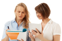 Woman showing something in her folder to colleague