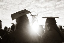 sunlight shining on the heads of high school graduates 
