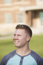 headshot of a smiling college student on campus 