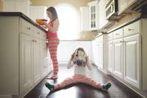 girls in pajamas a kitchen 