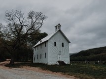 a rural white church and cemetery 