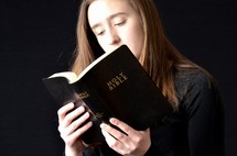 teen girl reading a Bible t