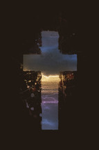 painted cross with sunset