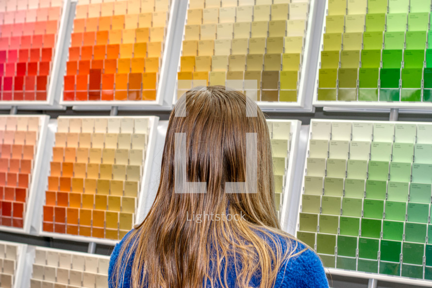 girl selecting a paint color 