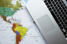 laptop on a world map 