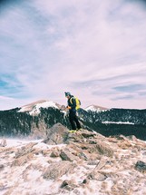 Man hiking on a snow-covered mountain.