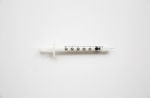 A hypodermic needle on a white background.