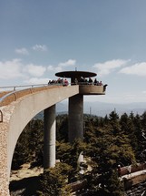 tourists taking in the views at a lookout site 