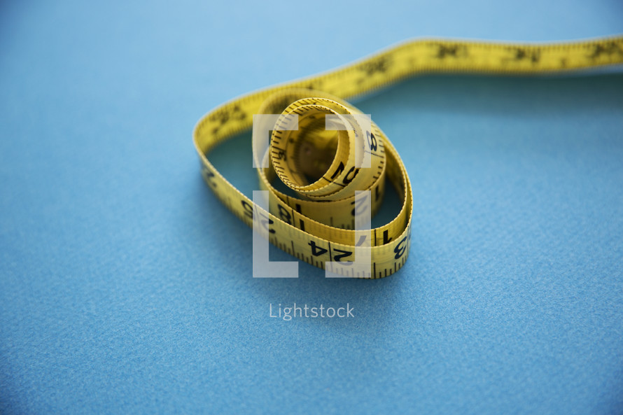 measuring tape on a blue background 