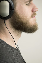 man listening to music with headphones. 