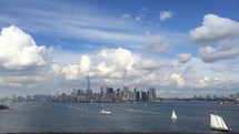 NYC city skyline across water 