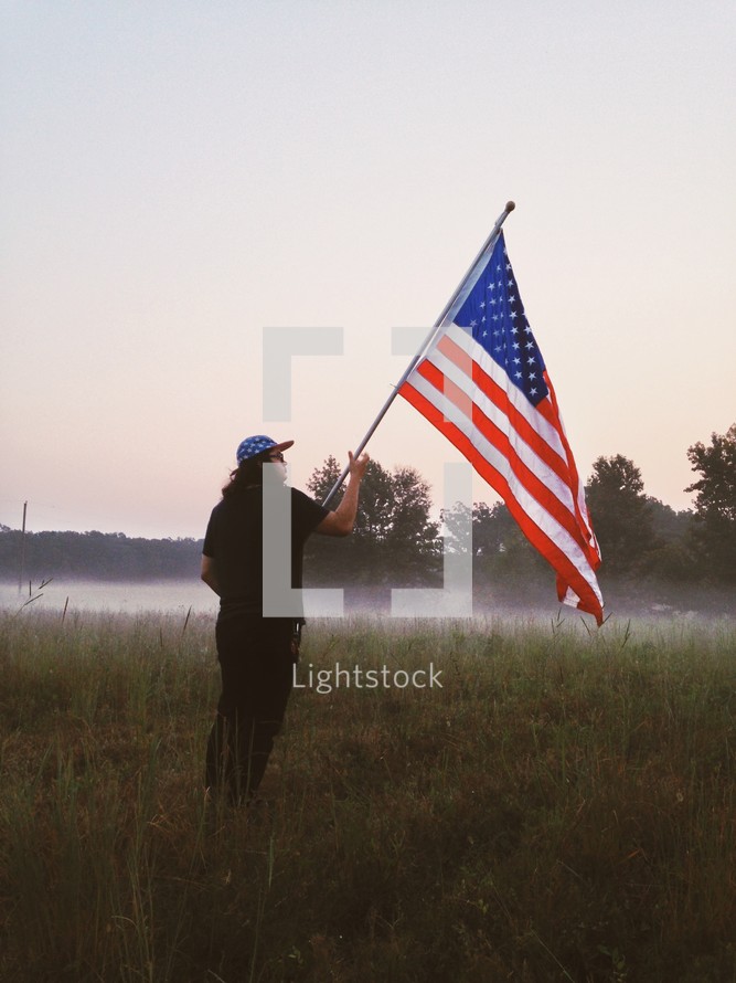 man holding an American flag