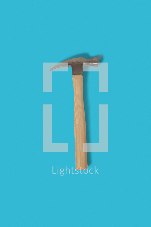 hammer against a blue background 