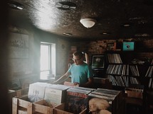 a man shopping in a record store 