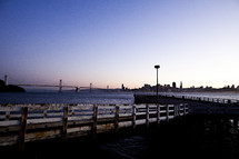 city dock looking at ocean San Francisco Bay bridge sunset