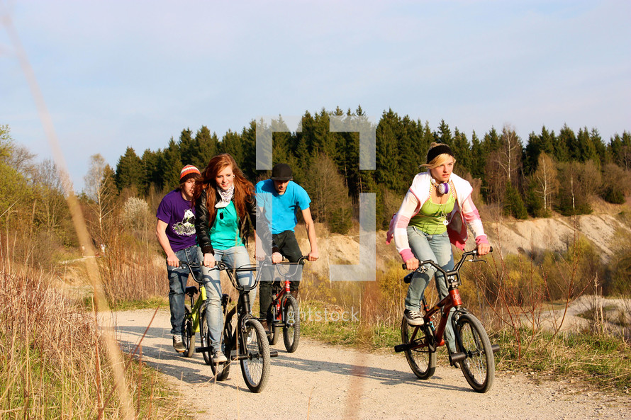 teenagers riding bike 