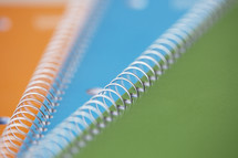 close up of spiral notebooks.