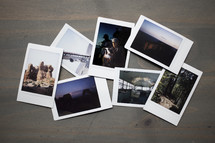 Group of Travel Polaroid Film Photographs Lay on Wooden Table