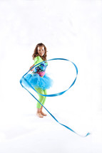 girl child performing rhythmic gymnastics