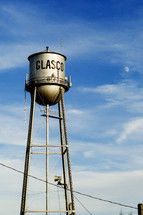 Glasco water tower in daylight against blue sky.