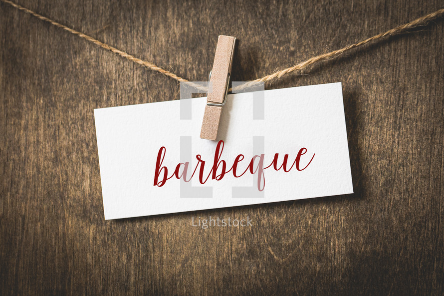 word barbeque hanging on a clothesline 