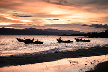 fishing boats at sunset 
