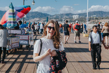 happy woman on a pier 