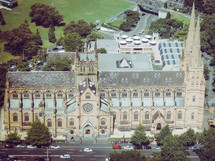 aerial view over a large church 